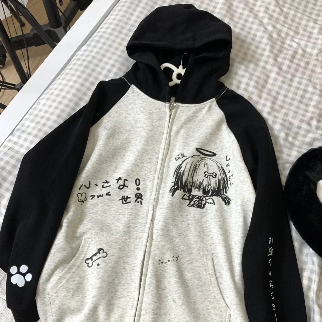 Hoodie with black and white design on a checkered surface